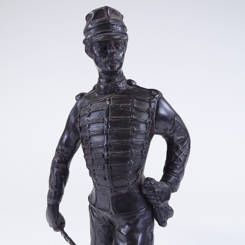 135 - A patinated bronze sculpture of a hussar, early 20th century, unsigned, on wood plinth, height 38cm