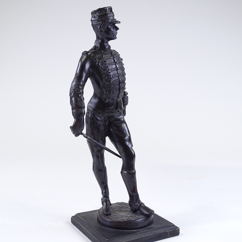 135 - A patinated bronze sculpture of a hussar, early 20th century, unsigned, on wood plinth, height 38cm