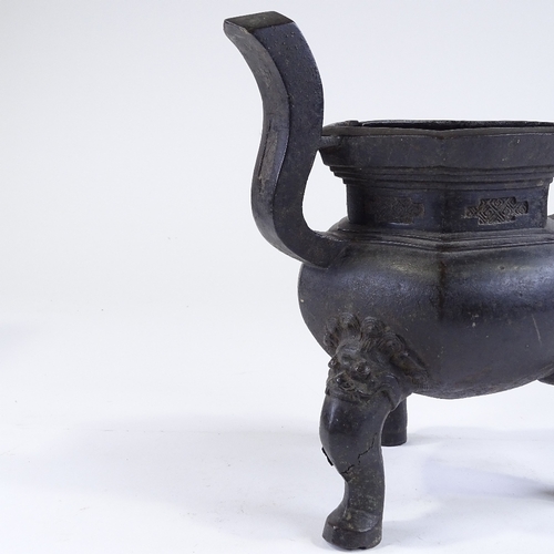 136 - A Chinese patinated bronze incense burner, resting on 3 dragon design feet, overall height 28cm