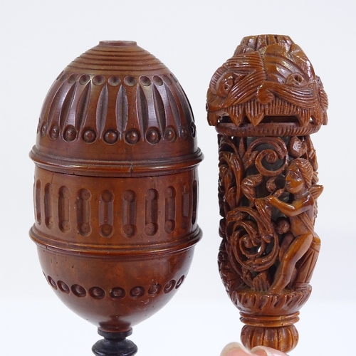 22 - A 19th century carved coquilla nut lidded cup on ivory stand, height 13.5cm, and an ornately carved ... 