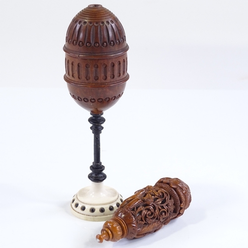 22 - A 19th century carved coquilla nut lidded cup on ivory stand, height 13.5cm, and an ornately carved ... 