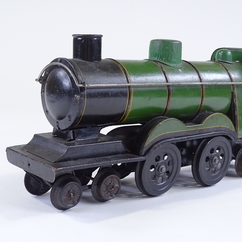 24 - A Vintage tinplate toy carpet steam locomotive, length 32cm