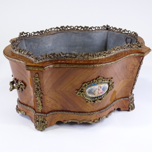 25 - A 19th century French kingwood planter of serpentine-shaped rectangular form, with cast-ormolu mould... 