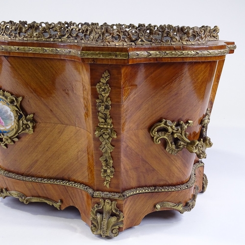 25 - A 19th century French kingwood planter of serpentine-shaped rectangular form, with cast-ormolu mould... 