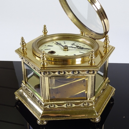 30 - A Victorian brass-cased desk clock of hexagonal form, enamel dial and secondary dial, bevel-glass pa... 