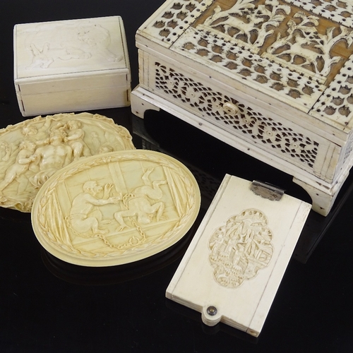 31 - A 19th century bone fretwork decorated jewel box, length 14cm, a Chinese relief carved ivory card ca... 