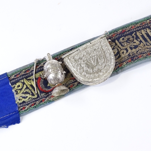 43 - An Arab white metal mounted jambiya knife with belt and fittings