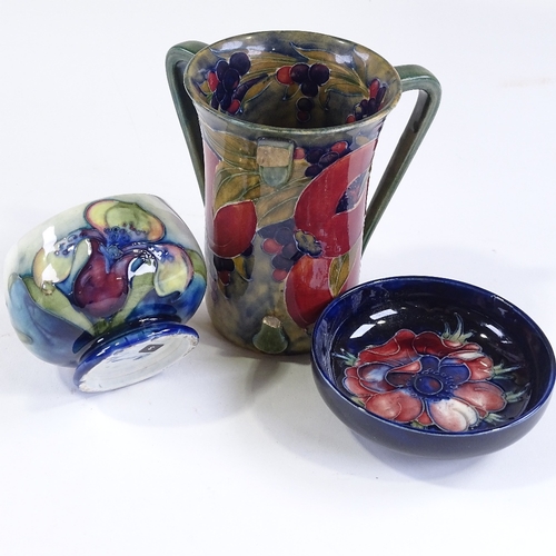 76 - A Vintage Moorcroft passion fruit design tyg, height 14cm (missing one handle), and 2 small Moorcrof... 