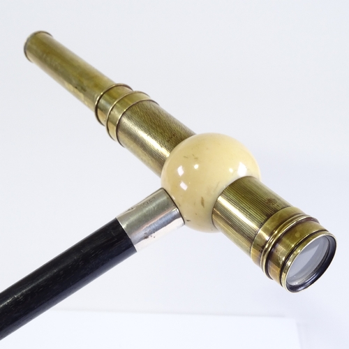 8 - A rare ivory and brass telescope-handled walking cane, the ivory ball top enclosing a brass 2-draw t... 