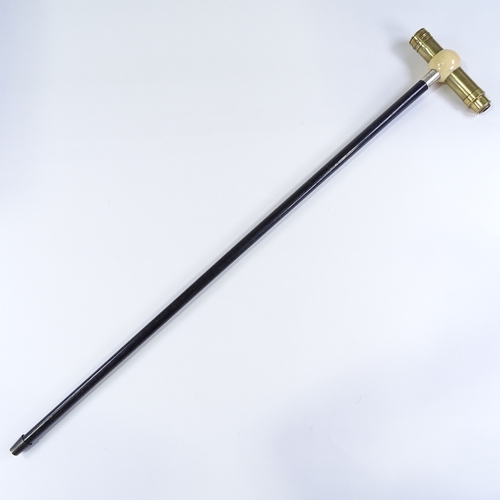 8 - A rare ivory and brass telescope-handled walking cane, the ivory ball top enclosing a brass 2-draw t... 