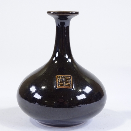 86 - Poh Chap Yeap (1927 - 2007), porcelain bottle vase with black tenmoku glaze, and applied plaque/seal... 