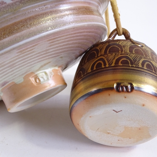 90 - Mary Rich (born 1940), gold and lustre decorated footed bowl, diameter 15cm, and a similar cane-hand... 