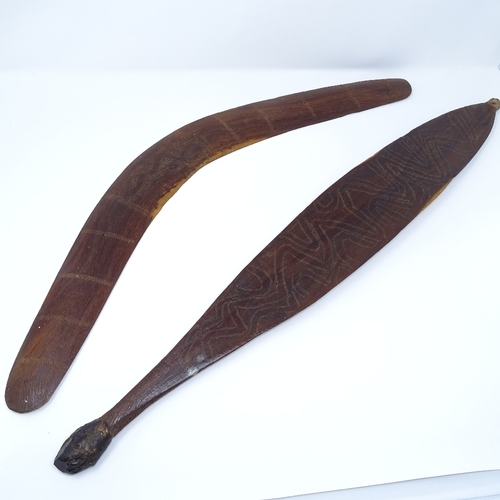 106 - An Aboriginal hardwood boomerang, with engraved zigzag designs, and a similar engraved woomera, leng... 