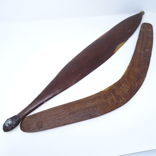 106 - An Aboriginal hardwood boomerang, with engraved zigzag designs, and a similar engraved woomera, leng... 