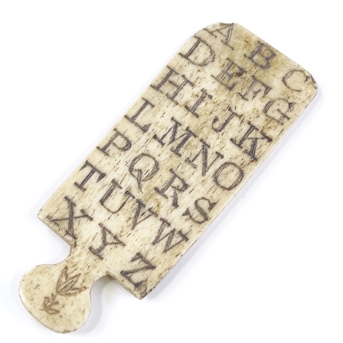 18 - A Napoleonic prisoner of war carved bone alphabet board, engraved letters to both sides, with floral... 