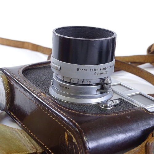 3 - A Leica M2 camera, circa 1959, serial no. 936958, with original 9cm F4 Elmar lens (some internal haz... 