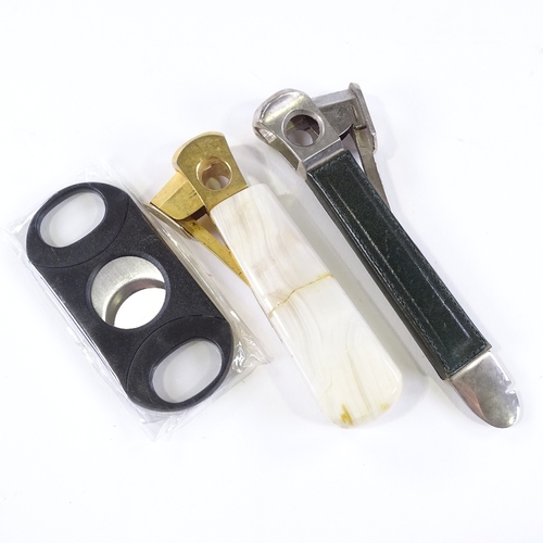 95 - 2 Antique cigar cutters, and another