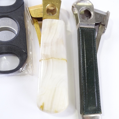 95 - 2 Antique cigar cutters, and another