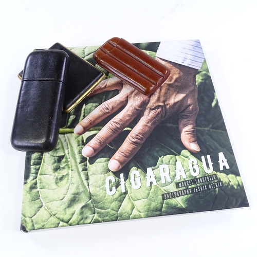 97 - A book entitled Cigaragua by Marcel Langedijk, and 3 Vintage cigar cases