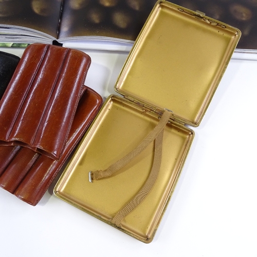 97 - A book entitled Cigaragua by Marcel Langedijk, and 3 Vintage cigar cases