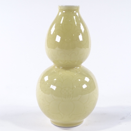 104 - A Chinese yellow glaze porcelain double gourd vase, with incised floral designs, 4 character mark, h... 