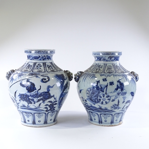 105 - A large pair of Chinese blue and white porcelain jars, with relief dragon mask handles and painted d... 