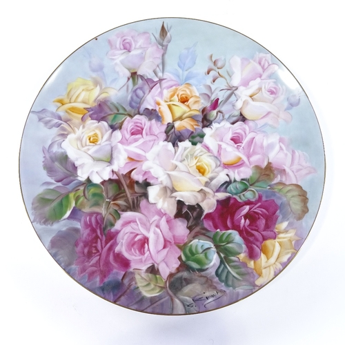 107 - A Noritake porcelain charger with hand painted rose design, signed S Kimuta, diameter 35cm