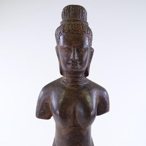 111 - An Oriental patinated bronze standing figure, overall height 46cm