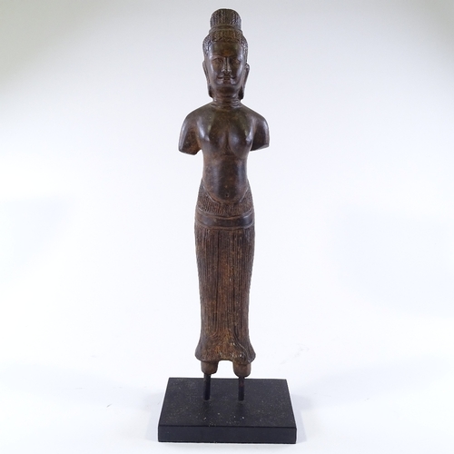 111 - An Oriental patinated bronze standing figure, overall height 46cm