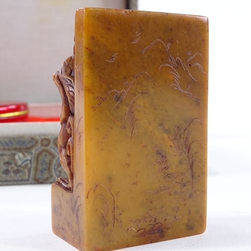 112 - A Chinese carved dragon design soapstone seal, height 7.5cm, in silk case