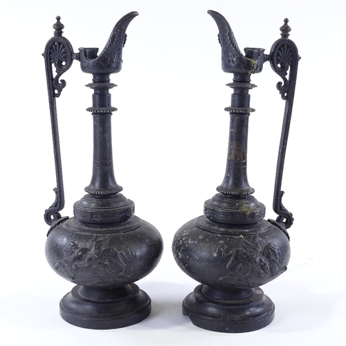 114 - A pair of 19th century patinated spelter ewers on marble bases, height 27cm