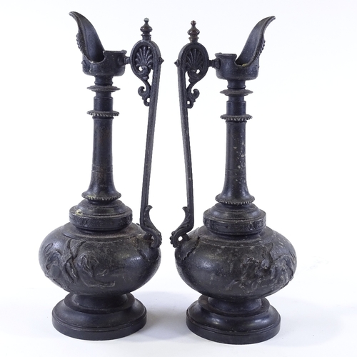 114 - A pair of 19th century patinated spelter ewers on marble bases, height 27cm