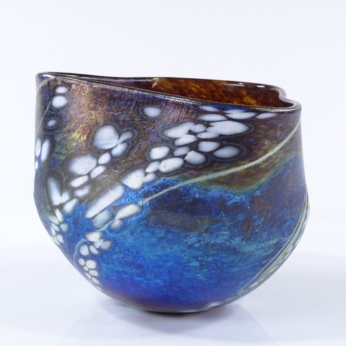 120 - A handmade Studio coloured glass iridescent bowl with shaped rim, height 10cm