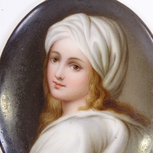 A 19th century hand painted porcelain plaque after Guido Reni