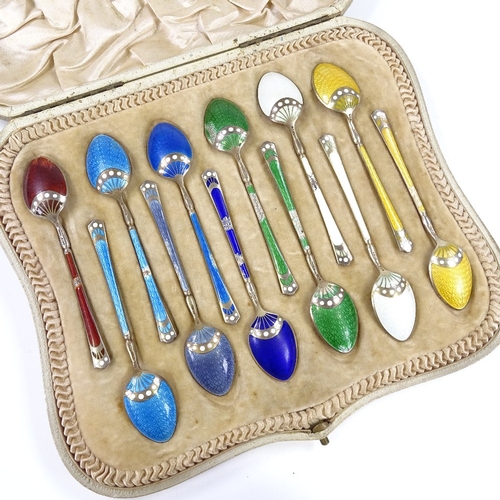 557 - A set of 12 Norwegian sterling silver-gilt harlequin enamel coffee spoons, possibly by David Anderse... 