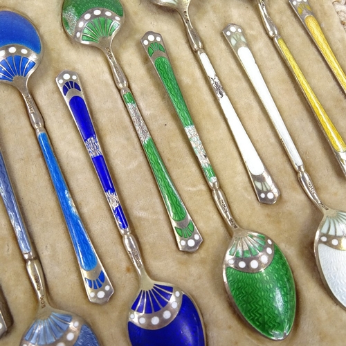 557 - A set of 12 Norwegian sterling silver-gilt harlequin enamel coffee spoons, possibly by David Anderse... 