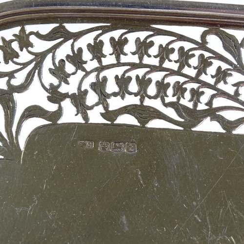 558 - A square silver cake stand, with pierced floral border, on pedestal base, by Frank Cobb & Co Ltd, ha... 