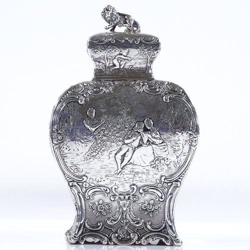 565 - A 19th century French silver tea caddy, of rectangular baluster form, with relief embossed lover sce... 