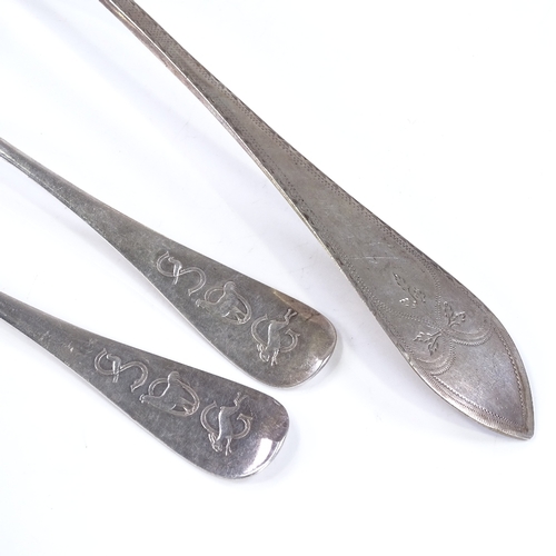 569 - A Danish silver gravy spoon, with bright-cut engraved decoration, length 30cm, together with a Conti... 