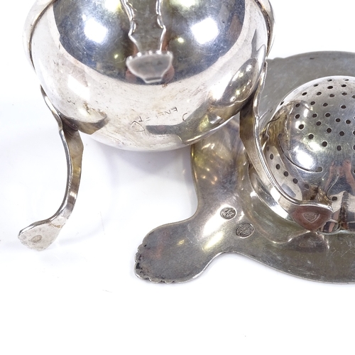 571 - A Danish silver tea strainer, with threaded rim, length 14.5cm, together with a similar silver plate... 