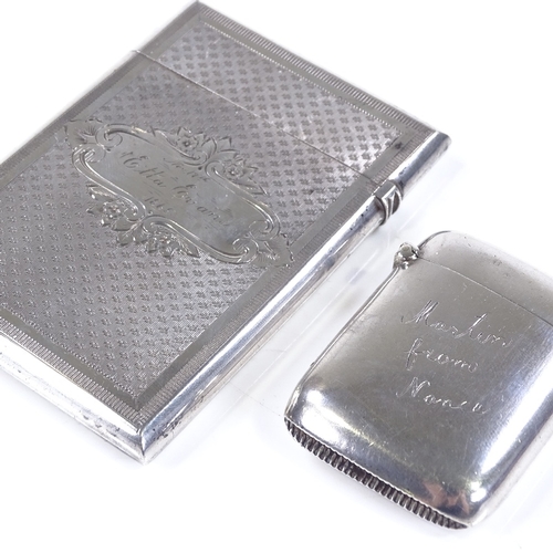 575 - A Victorian silver card case, with engine turned decoration and floral engraved cartouche, length 9c... 