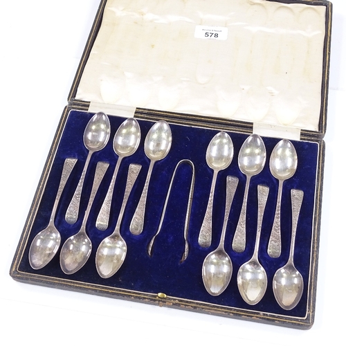 578 - A cased set of Edwardian silver teaspoons, and a pair of sugar tongs, with engraved floral handles, ... 