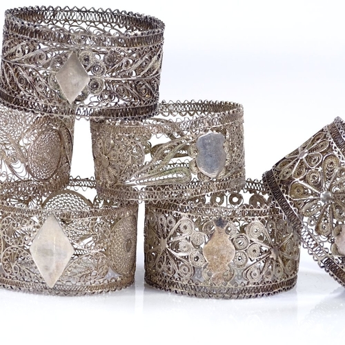 580 - A set of 6 silver filigree napkin rings, diameter 5cm, 3.3oz total