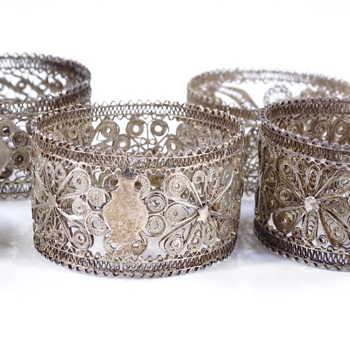 580 - A set of 6 silver filigree napkin rings, diameter 5cm, 3.3oz total