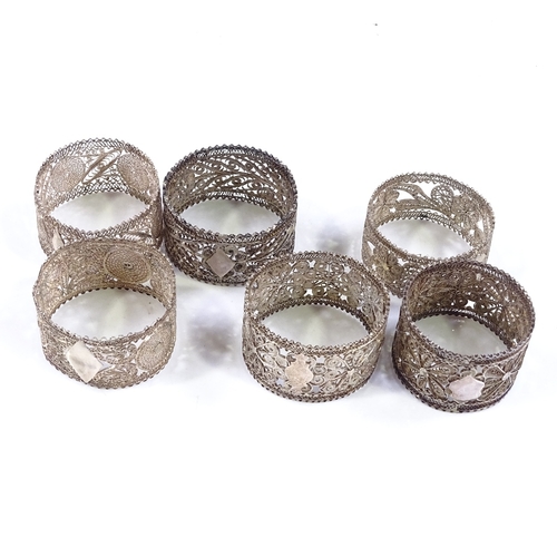 580 - A set of 6 silver filigree napkin rings, diameter 5cm, 3.3oz total