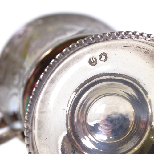 582 - A Victorian silver mug, with engraved floral decoration and cast-silver handle, with bead-edge foot,... 