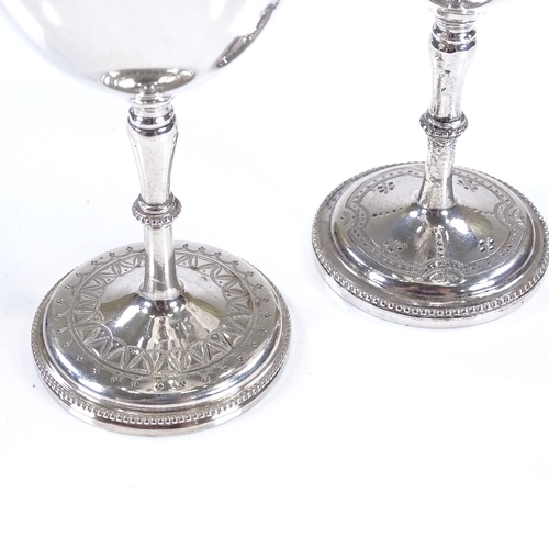 583 - 2 Victorian silver goblets, with engraved decoration and bead-edge foot, and gilt interior, by Henry... 