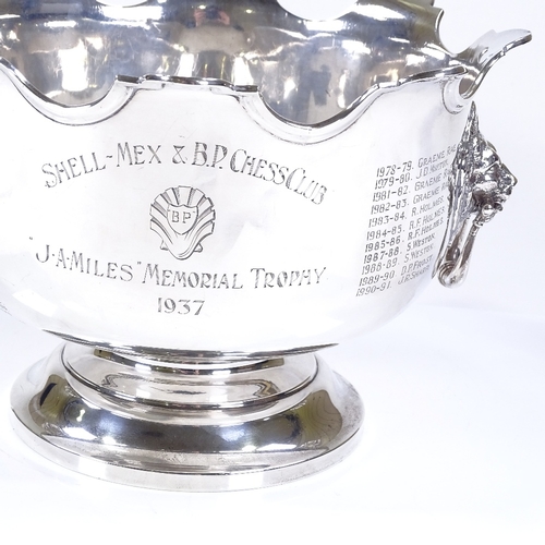 585 - A George V silver punch bowl, with cast-silver lion handles and scalloped rim, with Chess Tournament... 