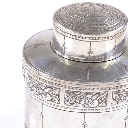 597 - A Liberty & Co oval silver tea caddy, with relief embossed Arts and Crafts fruit designs, hallmarks ... 