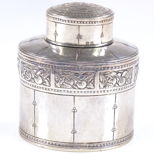 597 - A Liberty & Co oval silver tea caddy, with relief embossed Arts and Crafts fruit designs, hallmarks ... 